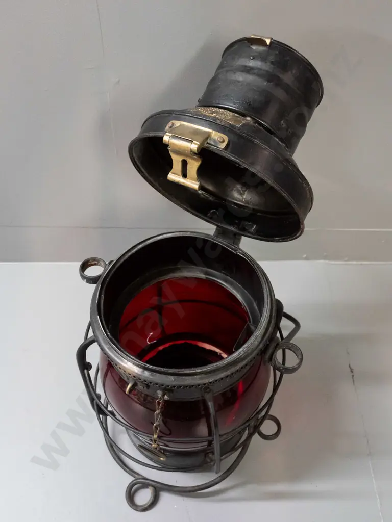 large ship's lantern with top and bottom handles, red glass bubble lens, w/ plaque: Davies Patent Windproof Ship Lamp. Image 1++