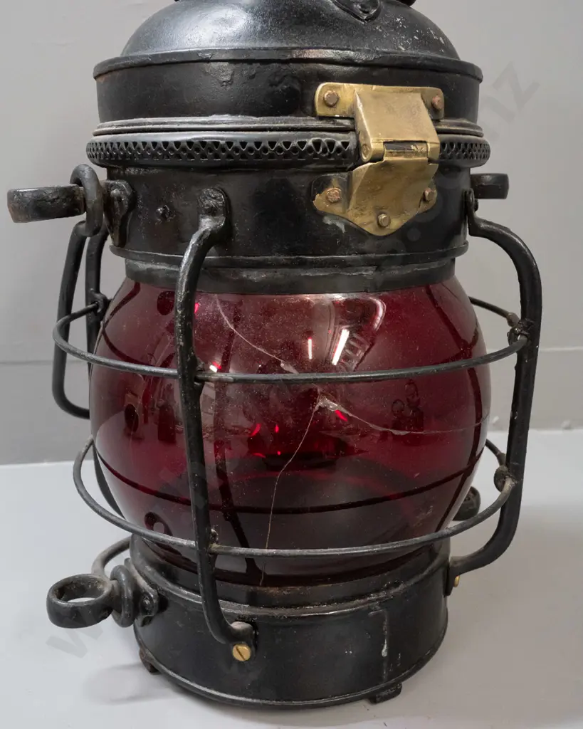large ship's lantern with top and bottom handles, red glass bubble lens, w/ plaque: Davies Patent Windproof Ship Lamp. Image 1++