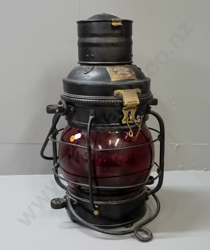 large ship's lantern with top and bottom handles, red glass bubble lens, w/ plaque: Davies Patent Windproof Ship Lamp. Image 1++