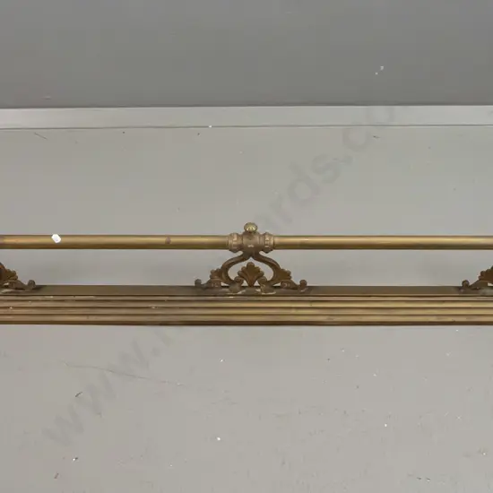 vintage brass fire surround on stepped, fluted base with finial capped corners, pierced nouveau style supports for rails