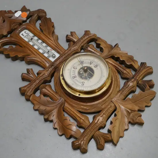 wall-hanging barometer & mercury-filled thermometer, carved walnut Black Forest style. Marked Made in Germany.