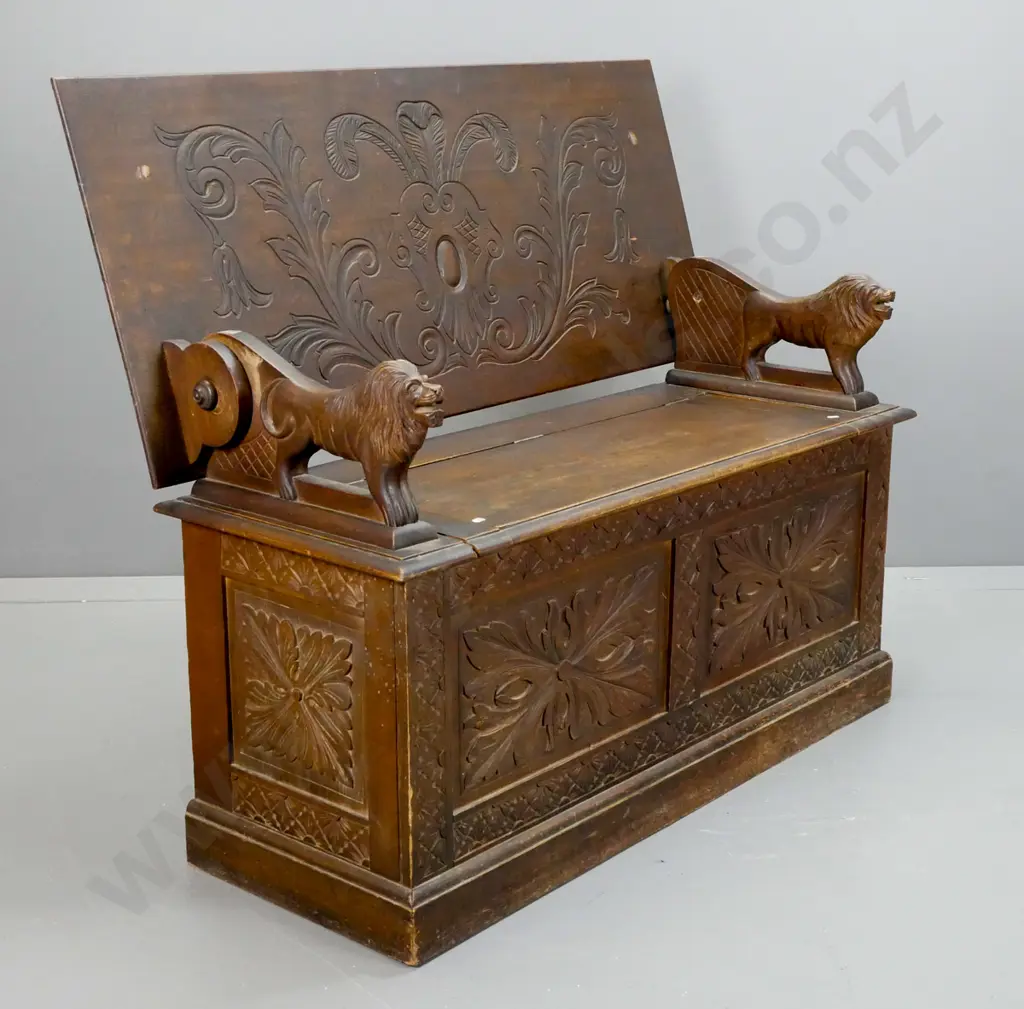 vintage Jacobean style oak monk's seat with carved foliate carved top & base panels, lion arm rests, seat back has Image 1++