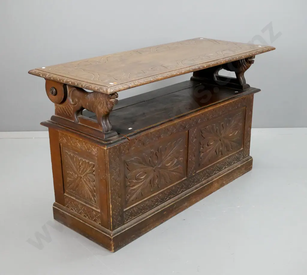 vintage Jacobean style oak monk's seat with carved foliate carved top & base panels, lion arm rests, seat back has Image 1++