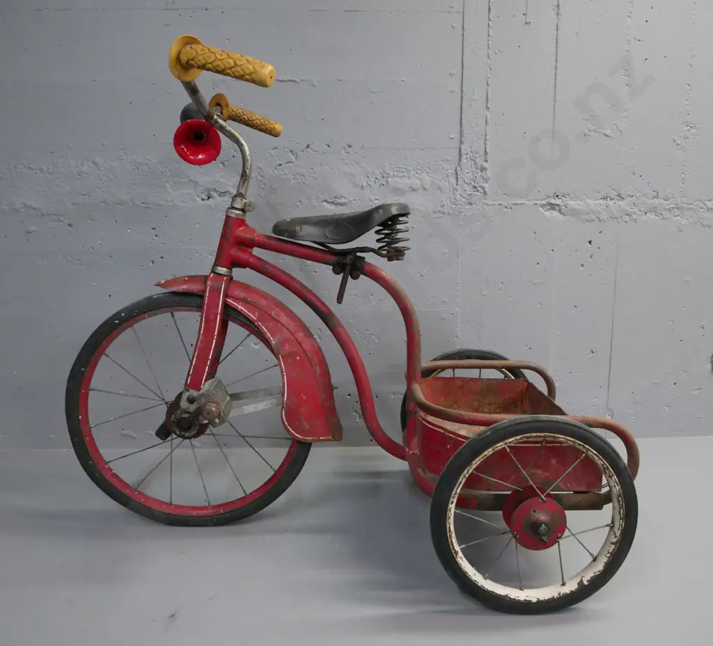 vintage child's spoke-wheel tricycle, red guards and rear carrier, red w/ white pinstriping, rubber tyres. Image 1++