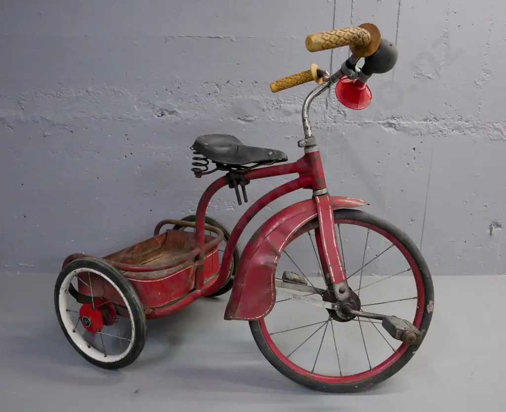 vintage child's spoke-wheel tricycle, red guards and rear carrier, red w/ white pinstriping, rubber tyres. Image 1++