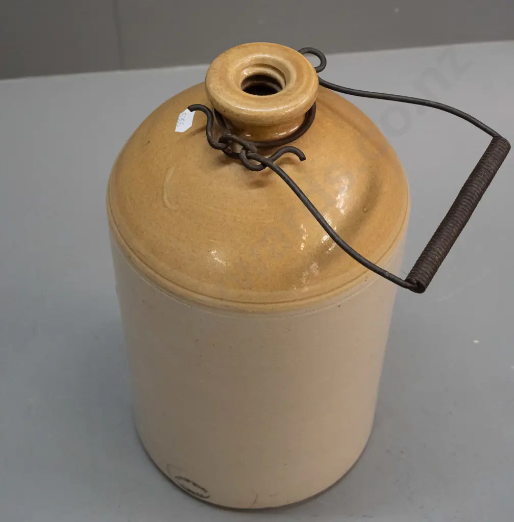 Stour Ware Timaru / West & Co Beverages Dunedin narrow mouth crock with wire handle, no stopper. Has firing crack Image 1++
