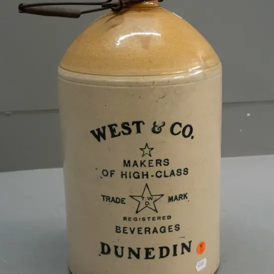 Stour Ware Timaru / West & Co Beverages Dunedin narrow mouth crock with wire handle, no stopper. Has firing crack