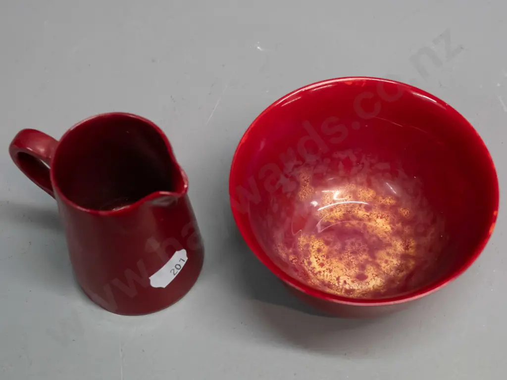 2 small pieces of Royal Doulton Flambe with plain text mark. Bowl has mottled yellow inside. Glaze wear to base of Image 1++