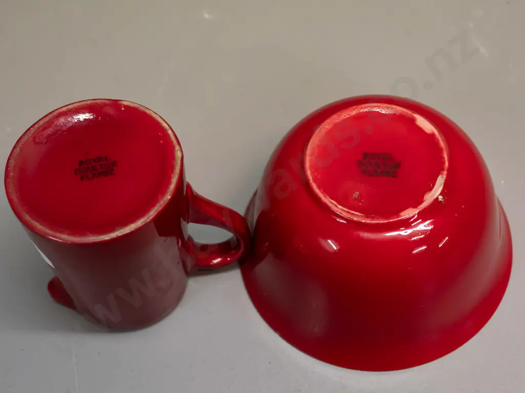 2 small pieces of Royal Doulton Flambe with plain text mark. Bowl has mottled yellow inside. Glaze wear to base of Image 1++