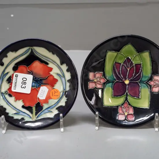 2x Moorcroft, England, tube-lined pin dishes with floral decoration. W-120