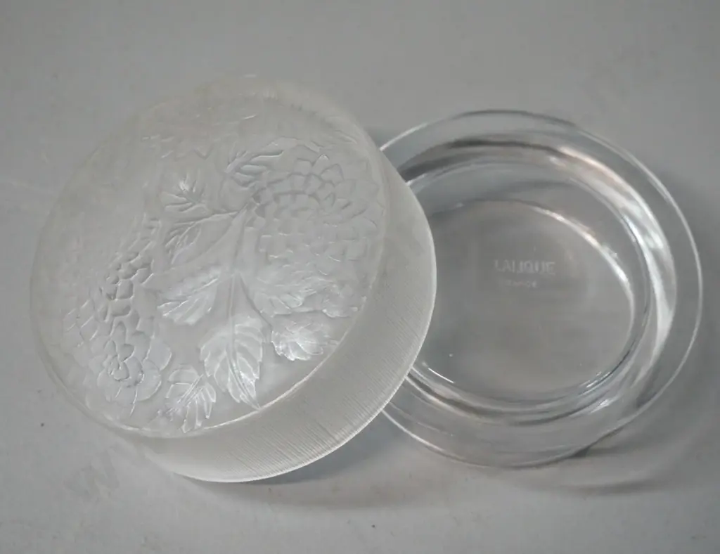 small frosted glass lidded canister with foliate and floral pattern, marked Lalique France. H-35 W-90 Image 1++