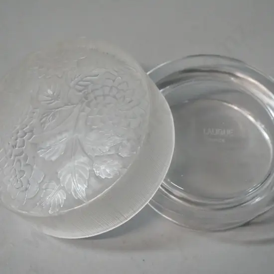 small frosted glass lidded canister with foliate and floral pattern, marked Lalique France. H-35 W-90