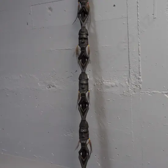 carved timber ceremonial totem or staff with dark stain - 4 heads with feather and bead earrings, unknown origin - wear