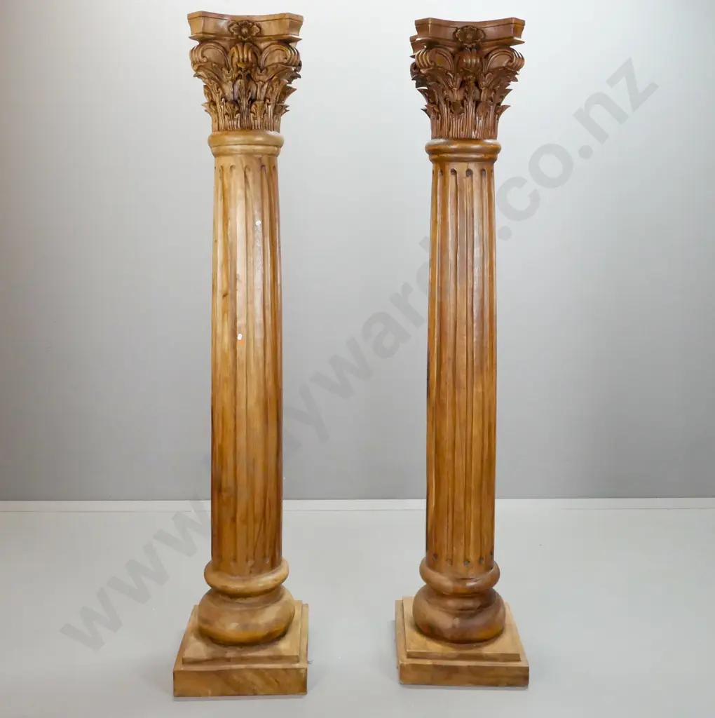 pair of Indonesian mahogany Romanesque columns on square stepped base with carved Corinthian style capital on fluted Image 1++