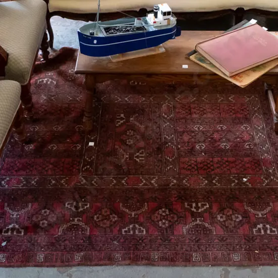 hand-knotted wool tribal floor rug in black, red, brown and orange - some wear to fringe, minor fading L-2300 W-1610