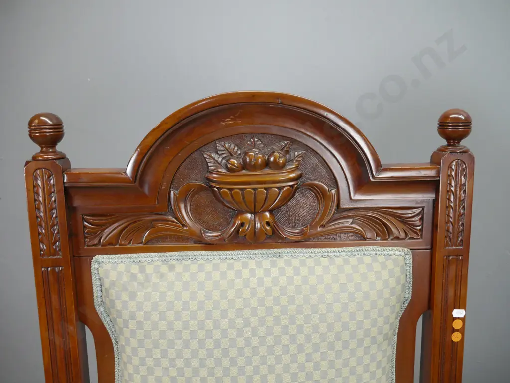 pair of vintage upholstered kauri armchairs with shaped carved back, fluted and foliate carved arms, turned legs - one Image 1++