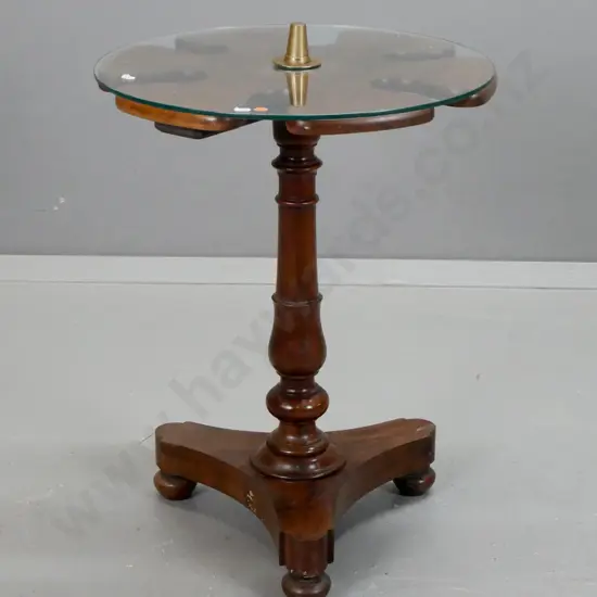 Victorian mahogany riding boot stand with revolving top, converted to table with glass top, turned column on tri foil