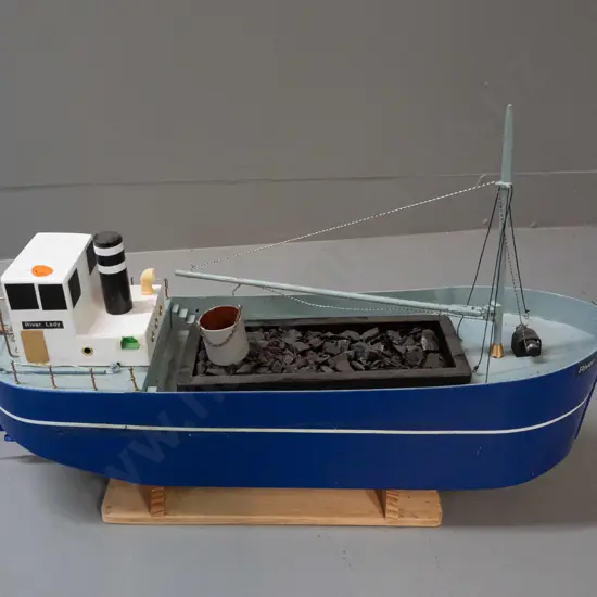 large motorised model boat - marked River Lady, with open coal hold, bucket and crane arm. On stand H-340 L-540