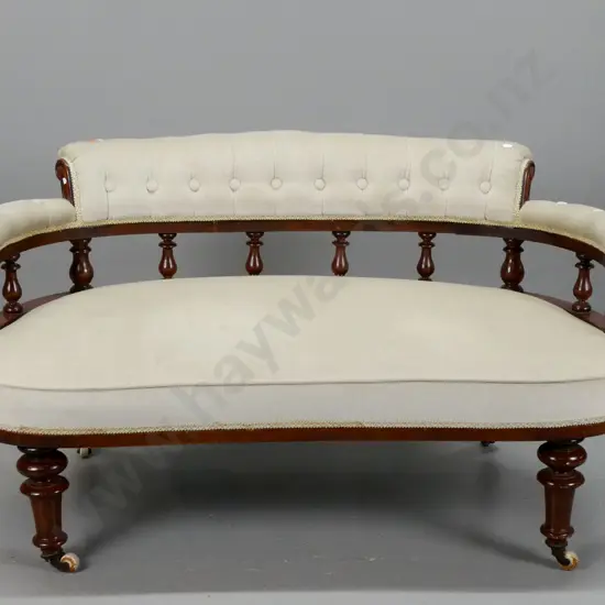 Victorian beech & kauri tub settee with rolled buttoned upholstered back, turned gallery, turned front legs, on