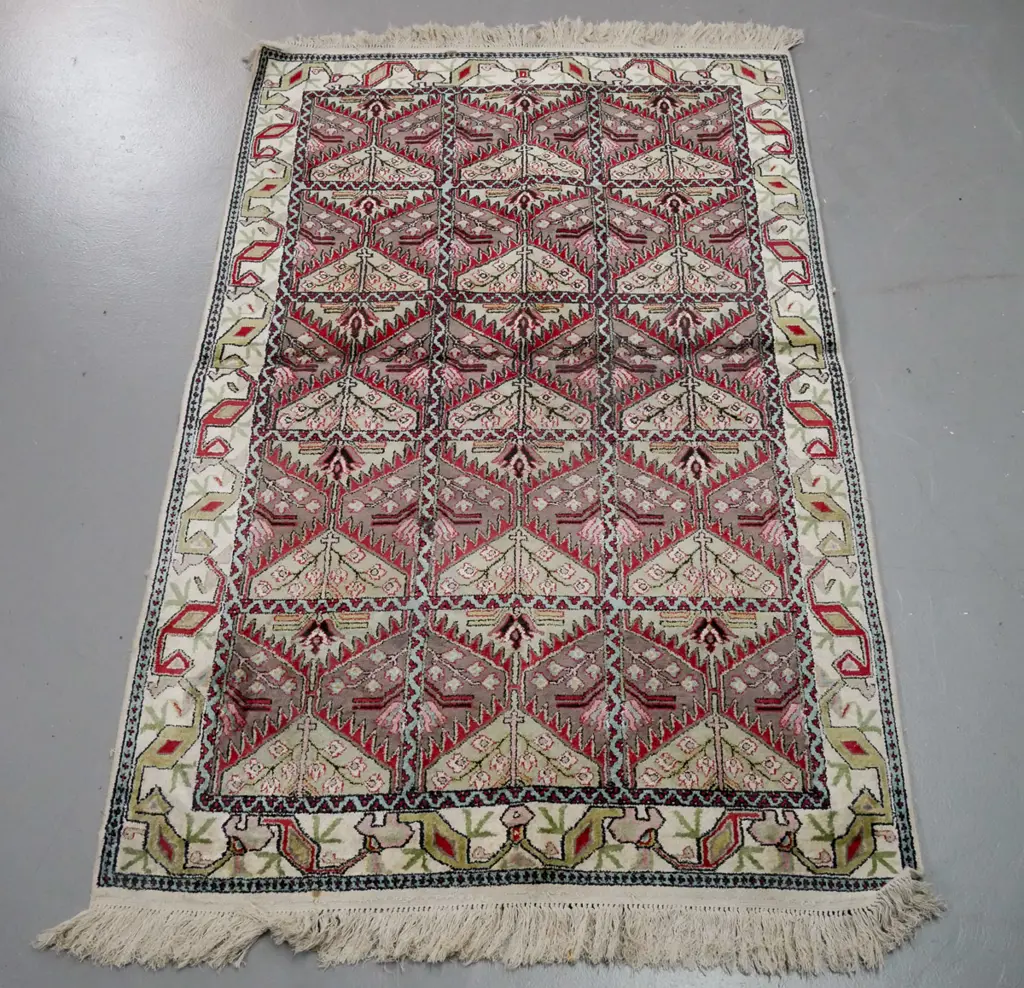 Persian / tribal style floor rug with geometric floral motifs, in faded reds, pinks, greens - a few stains L-1480 W-940 Image 1++