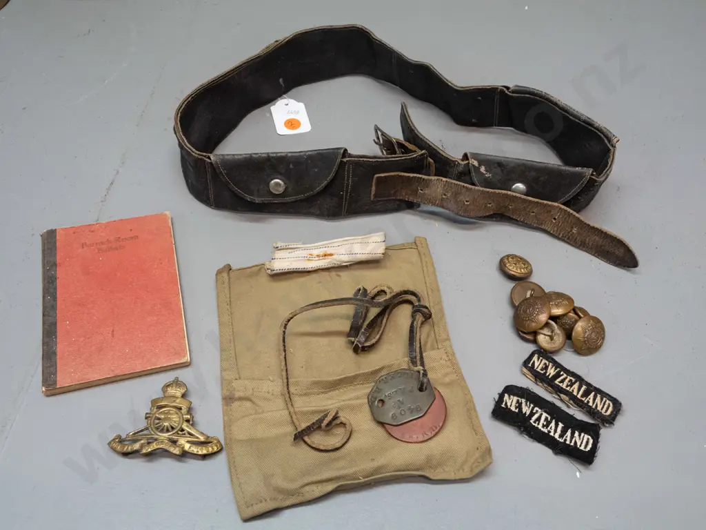WW1-era New Zealand military items - artillery cap badge, brass buttons, dog tags (name RD Miller) etc and a leather Image 1++