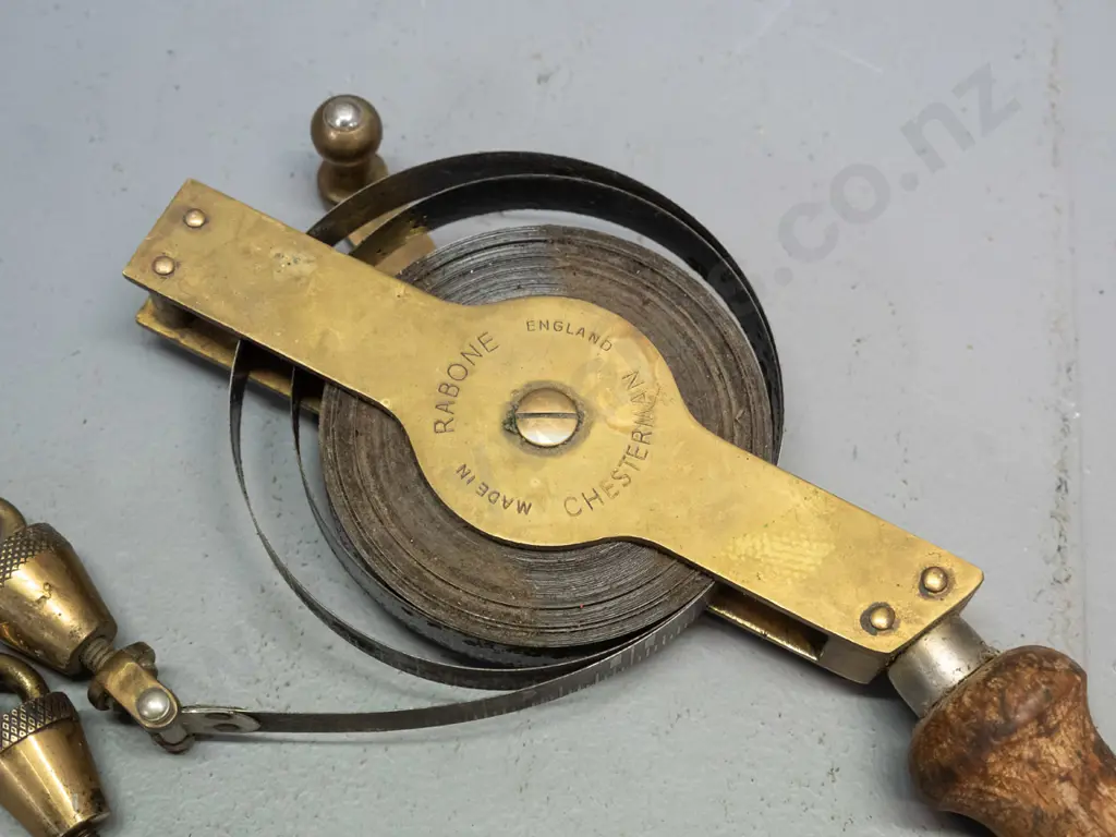 vintage Rabone Chesterman England measuring tape in inches with 2 plumb bobs, one marked with inches, one with metric - Image 1++