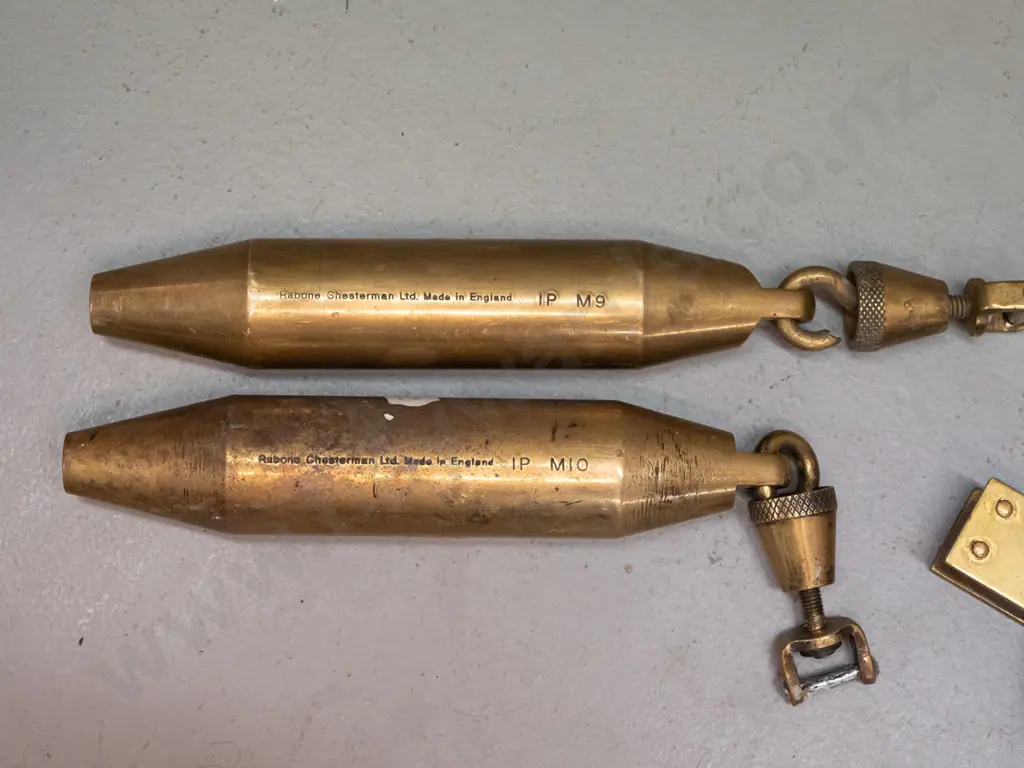 vintage Rabone Chesterman England measuring tape in inches with 2 plumb bobs, one marked with inches, one with metric - Image 1++
