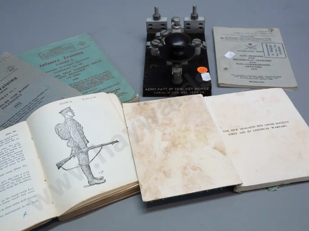 assorted military handbooks - signals training, first aid & chemical warfare, infantry training - and a morse key H-90 Image 1++