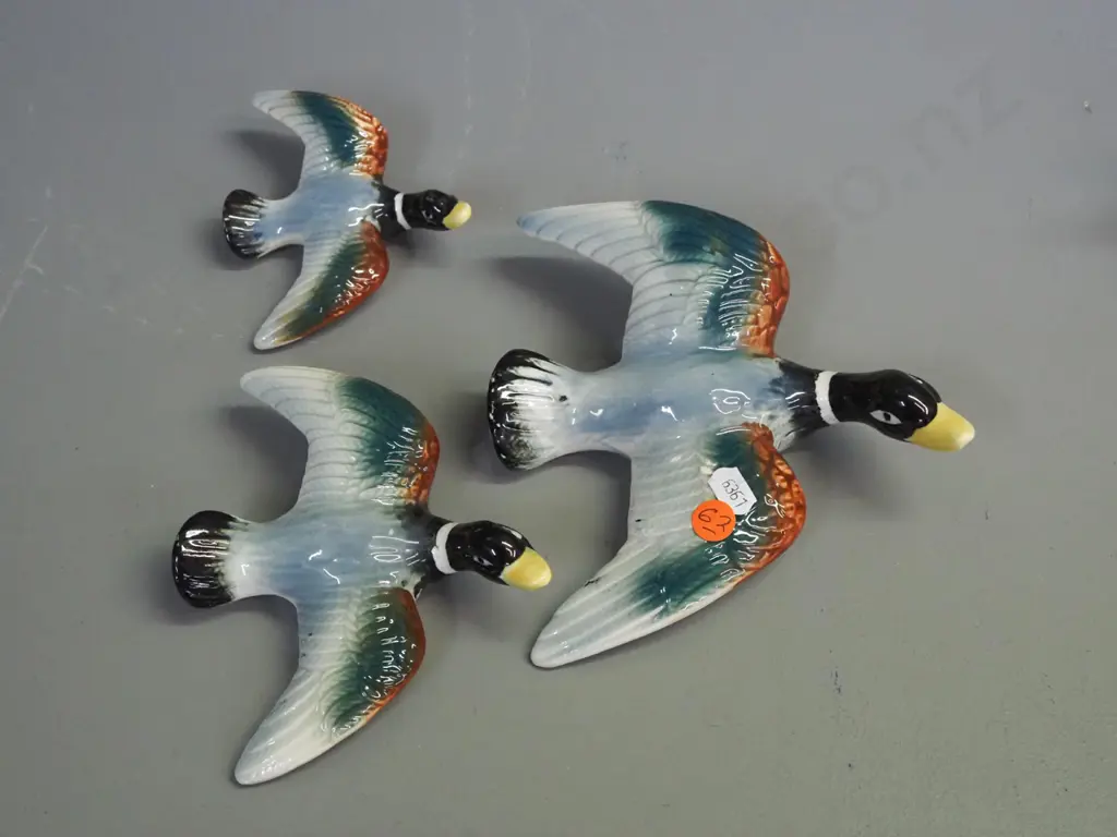 graduated set of 3 wall mount flying birds, no maker's marks - underside of wing tips have glaze loss. Largest L160 W170 Image 1++