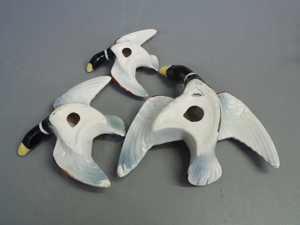 graduated set of 3 wall mount flying birds, no maker's marks - underside of wing tips have glaze loss. Largest L160 W170 Image 1++