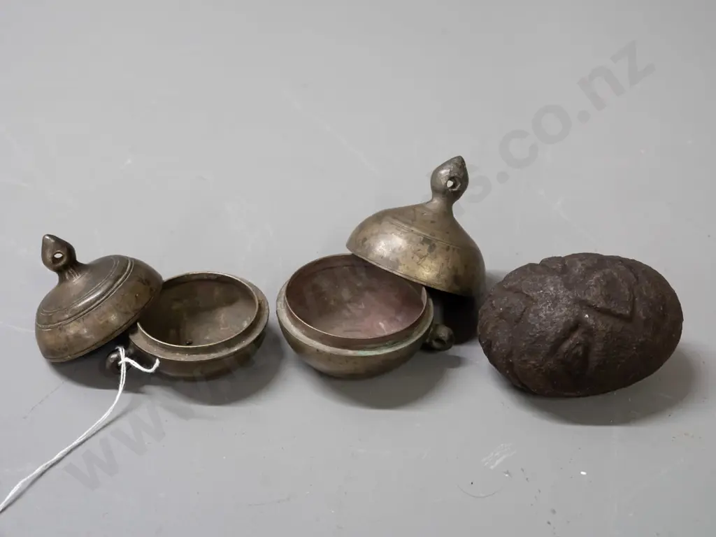 2 small gourd shaped metal storage canisters with lift off lids with strap or cord lugs on sides and a small carved Image 1++