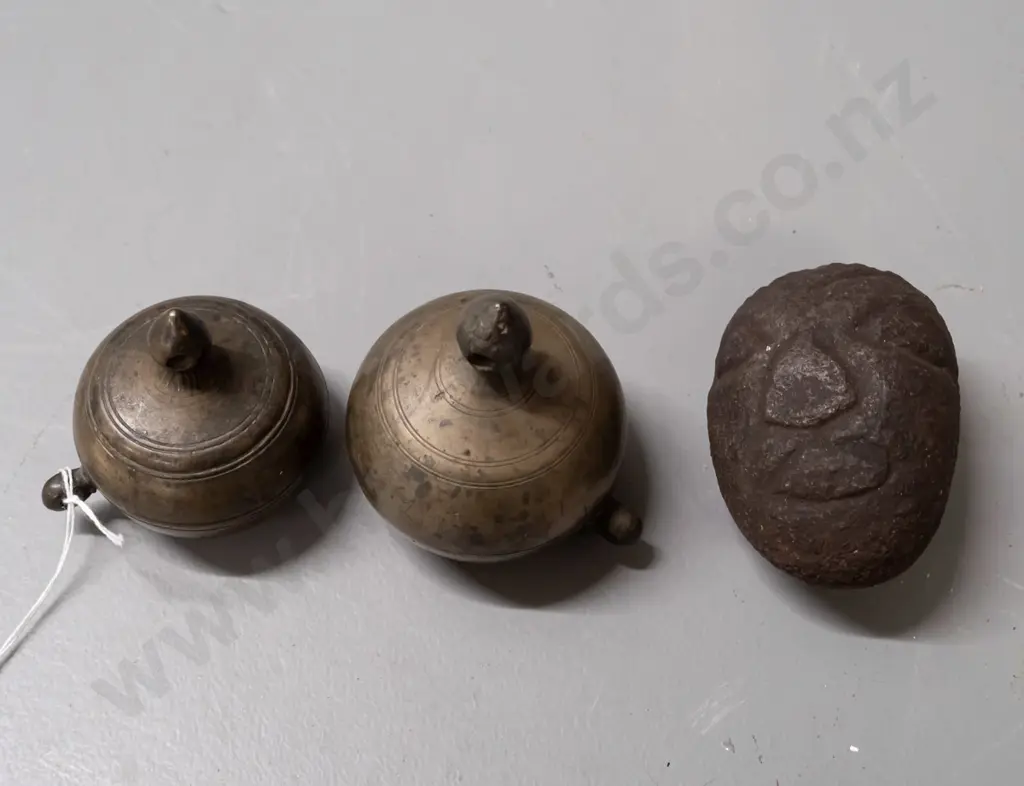 2 small gourd shaped metal storage canisters with lift off lids with strap or cord lugs on sides and a small carved Image 1++