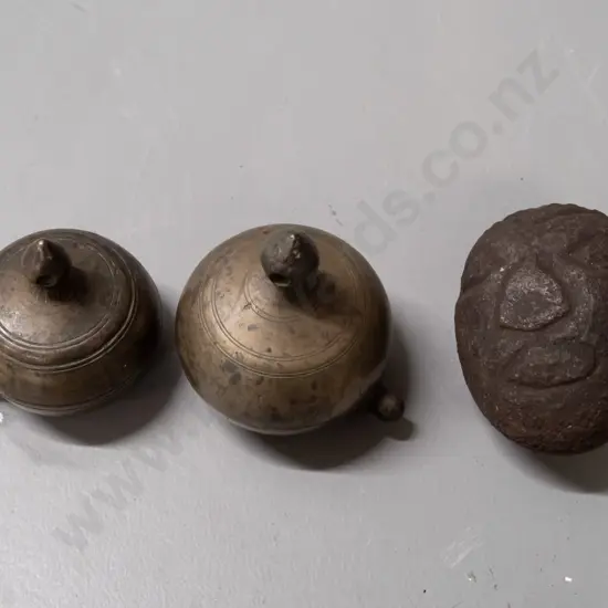 2 small gourd shaped metal storage canisters with lift off lids with strap or cord lugs on sides and a small carved