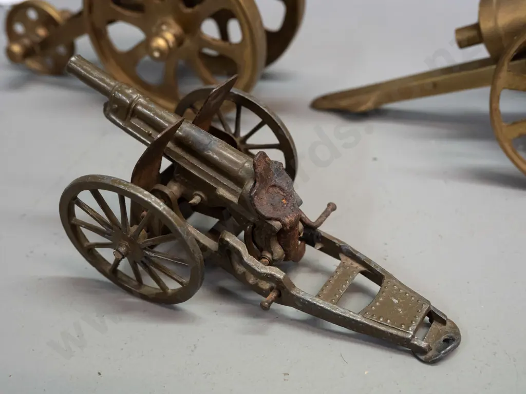 3 metal model cannons - 2 brass and a small cast metal Britains England. Largest is H-85 L-180 Image 1++