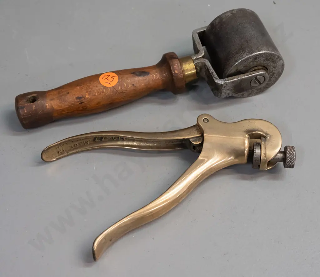 vintage wood-handled roller with heavy steel wheel, marked Dunlop, and a crimper or hand press marked Eclipse No. 77 Image 1++
