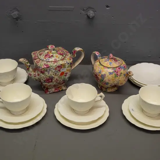 Two all-over floral teapots, Royal Winton 'Summertime', and 'Welbeck'. Four trios w/ 2 extra saucer & plate,Aynsley