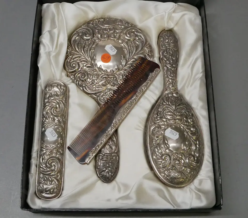Boxed vanity set. Sterling silver embossed classical pattern, hand mirror, 2x brushes, comb. Image 1++