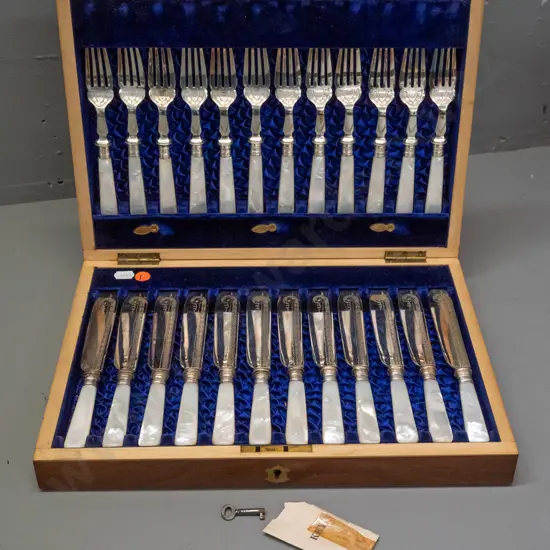 walnut cased set of 12 fish knives and forks with mother of pearl handles - engraved blades marked L&W with anchor -