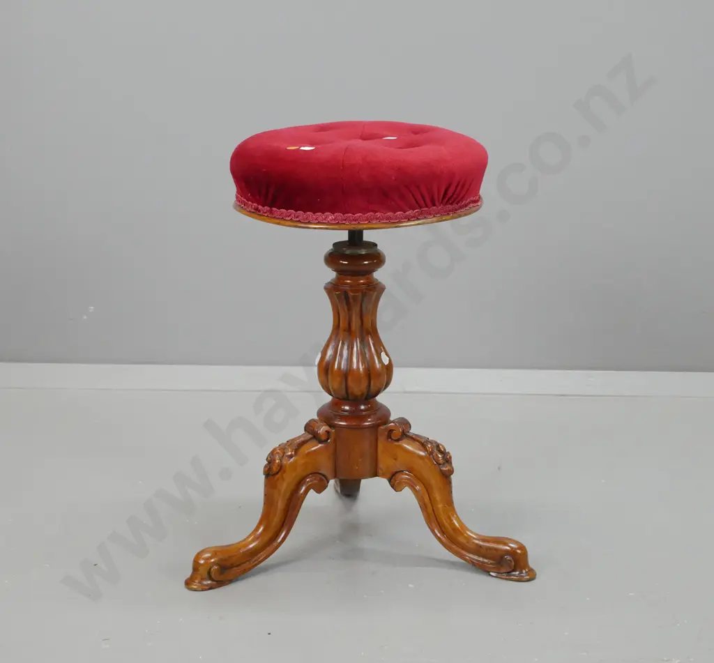 Victorian walnut revolving piano stool w/ shaped fluted column, 3 sweeping cabriole legs with carved floral knees Image 1++