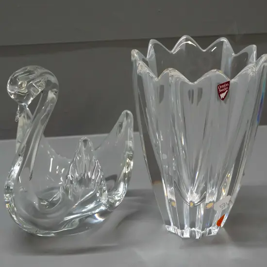 2 clear glass items - Orrefors Sweden fluted & petal shaped vase with label H-150, and a swan with no maker's marks