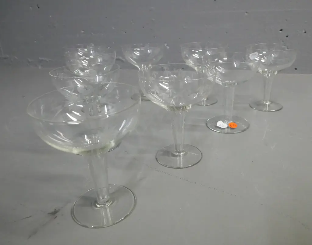 9x hollow-stemmed champagne glasses, etched floral decoration around bowl. H-120 Image 1++