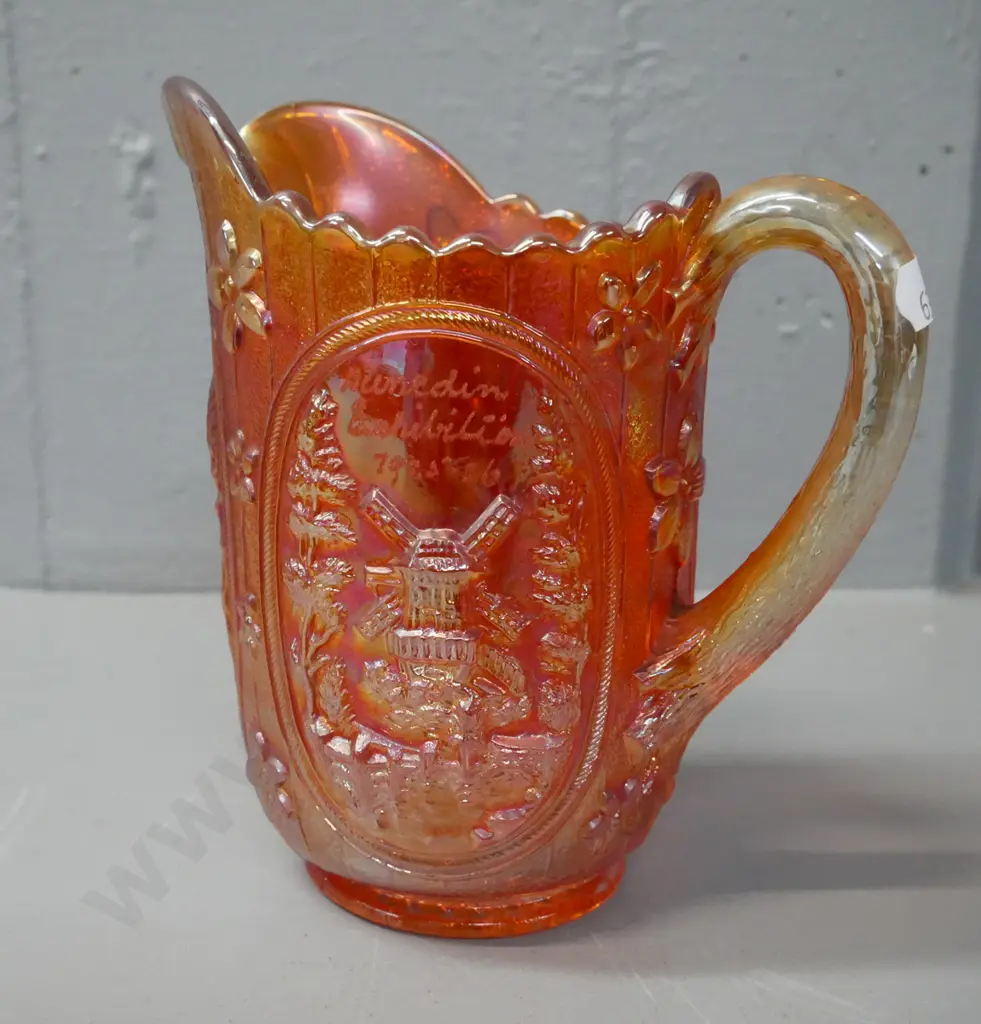 carnival glass orange lustre jug with 'Dunedin Exhibition 1925-26' engraved. H-160 W-160 Image 1++