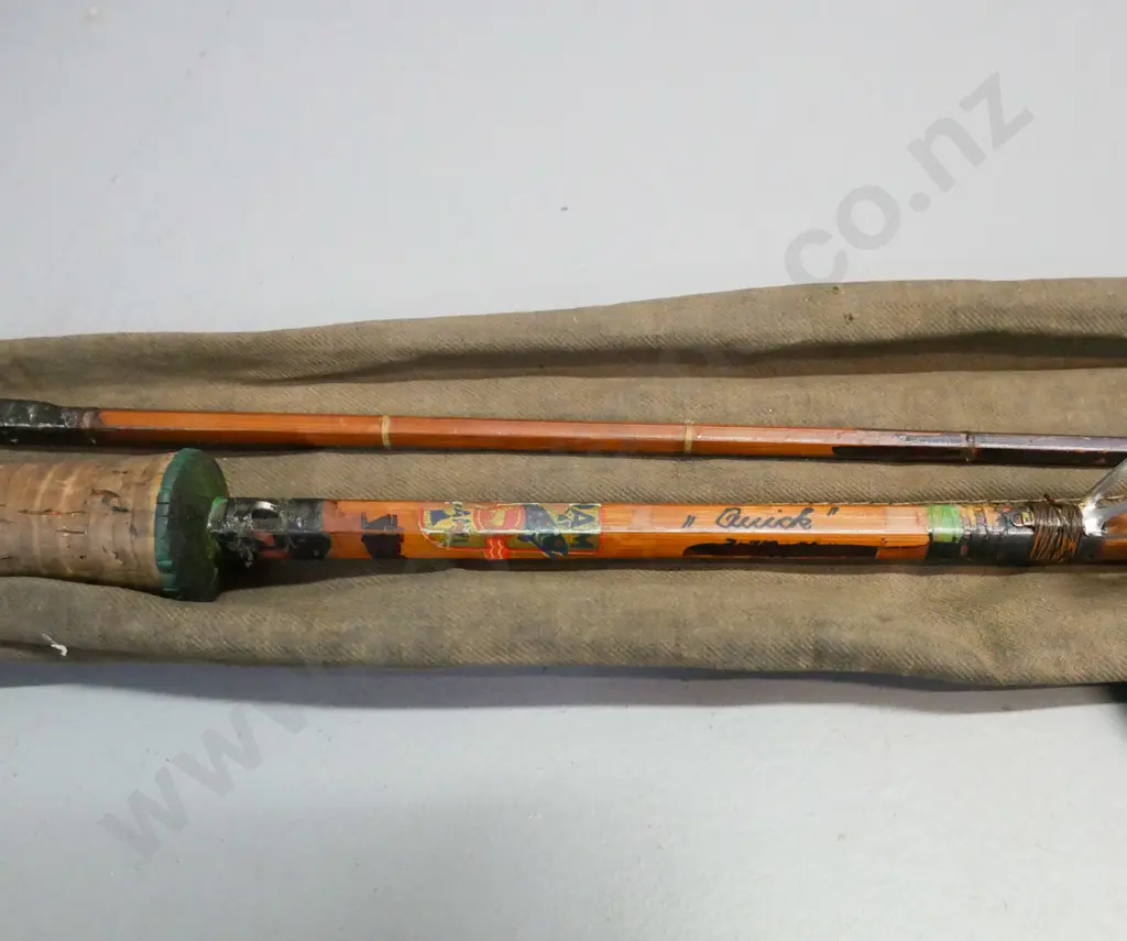 2-piece split cane fly rod, DAM brand, 'Quick'. New eyelets & binding. Some damage to cork handle. Tears to cloth bag. Image 1++
