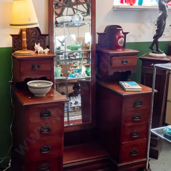 Victorian colonial kauri 10-drawer dresser with full length bevelled edge mirror, foliate carved pediment and uprights,