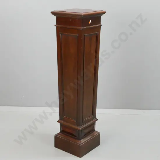 vintage mahogany and walnut plinth / display stand with panelled tapered sides, square top, plinth base. Top has split.