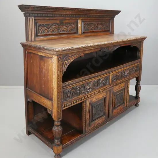 19th century French oak serving sideboard with upstand, foliate carved panels and gallery opening, 2 drawers with lion's