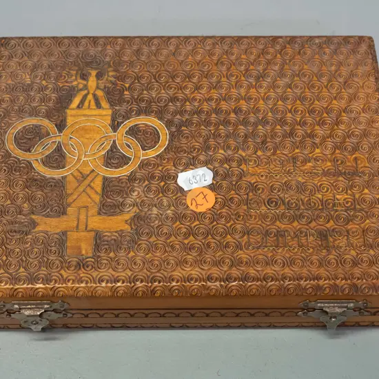 carved wooden souvenir games set with chess pieces - top marked with inlaid metal & wood - eagle and olympic logo,