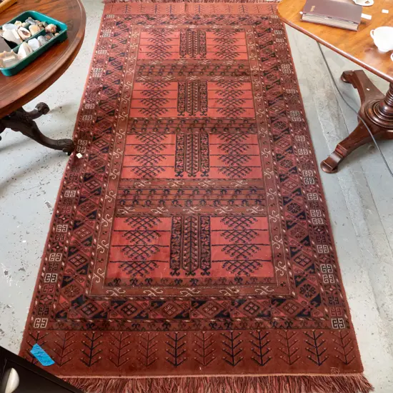 Persian style wool floor rug in reds, browns and blues - some staining, 2 spots of damaged pile L-2740 W-1390
