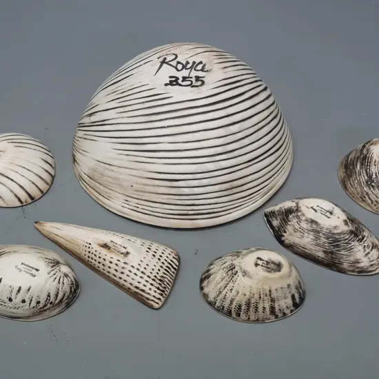 Royce McGlashen shell shaped studio pottery items - large bowl and 6 small various-shaped bowls - large bowl has small