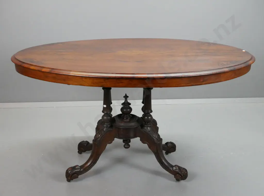 Victorian walnut oval loo table on 4-point cathedral base, stringing and inlay to top, carved legs, working tilt Image 1++